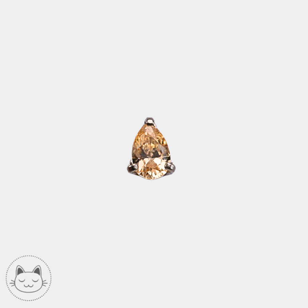 Bijou NeoMetal en titane avec zircon champagne taille poire 3 mm, présenté de face sur fond clair.